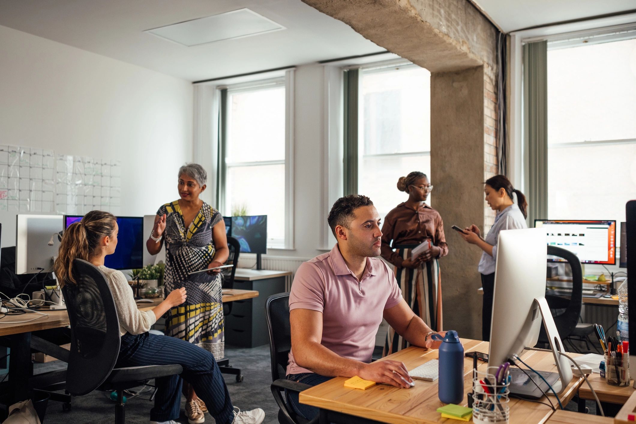 Remote team collaborating in a modern office